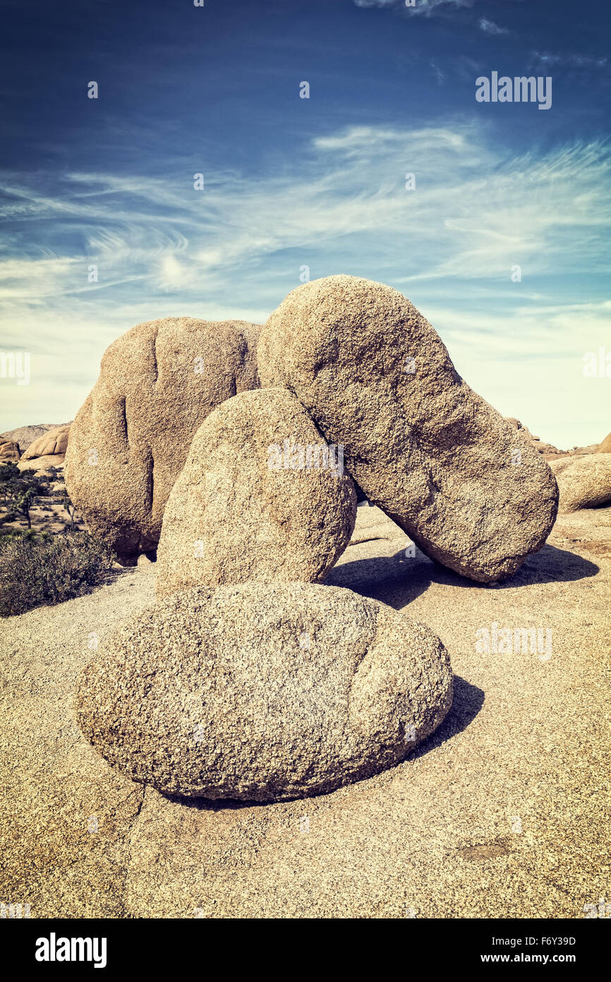 Balanced boulders create an interesting scene in Joshua Tree National Park, California Stock Photo
