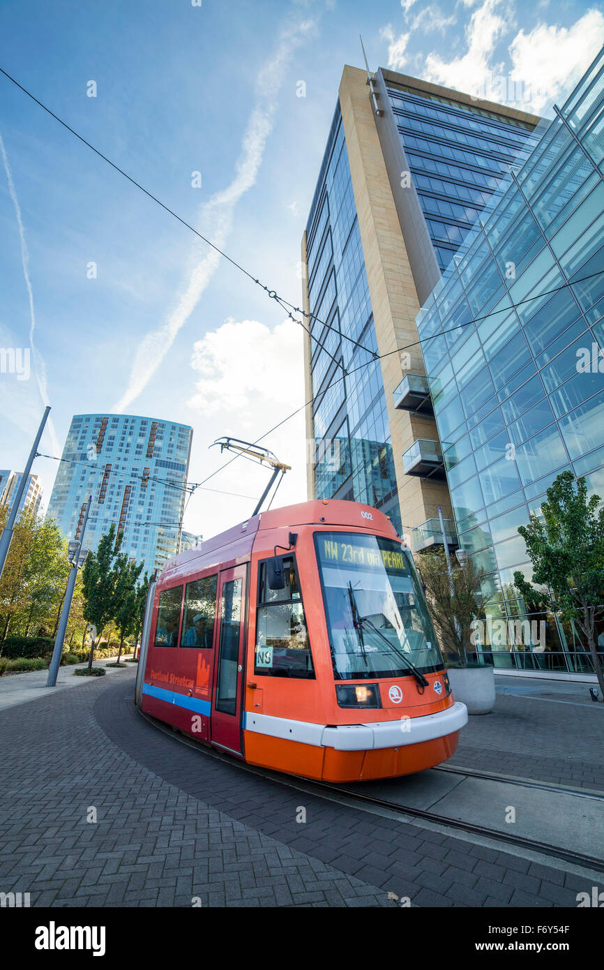 A streetcar leaves its stop on the  in Portland, Oregon. Stock Photo