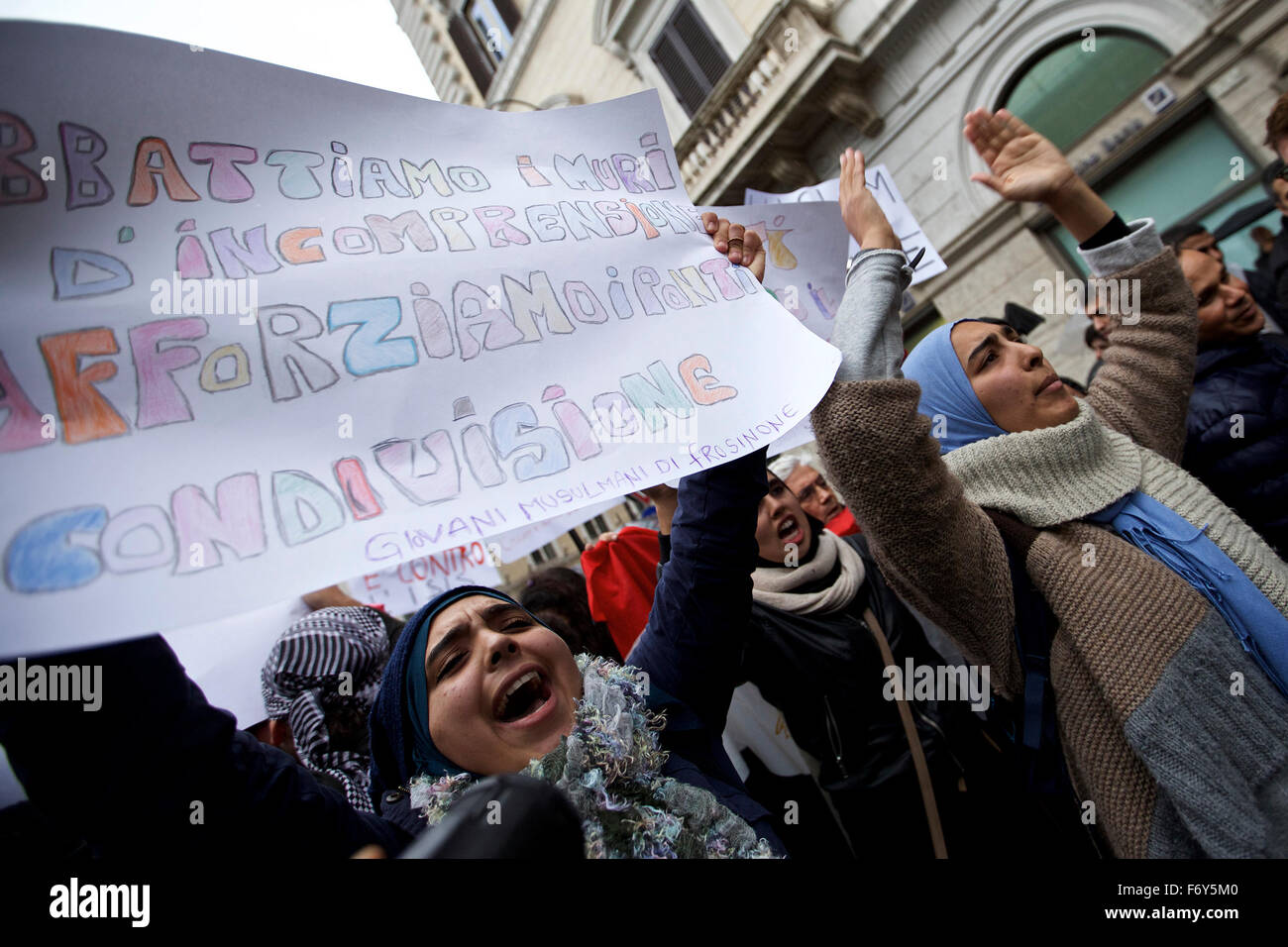 Rome, Italy. 21st Nov, 2015. Women shout slogans with a banner reading "Let's break down the walls of misunderstanding, let's strengthen the bridges of sharing" during a demonstration in Rome, Italy, on Nov. 21, 2015. A demonstration launched by Islamic communities with the theme "Not in My Name" is held here on Saturday to protest against the Paris terror attacks. Credit:  Jin Yu/Xinhua/Alamy Live News Stock Photo
