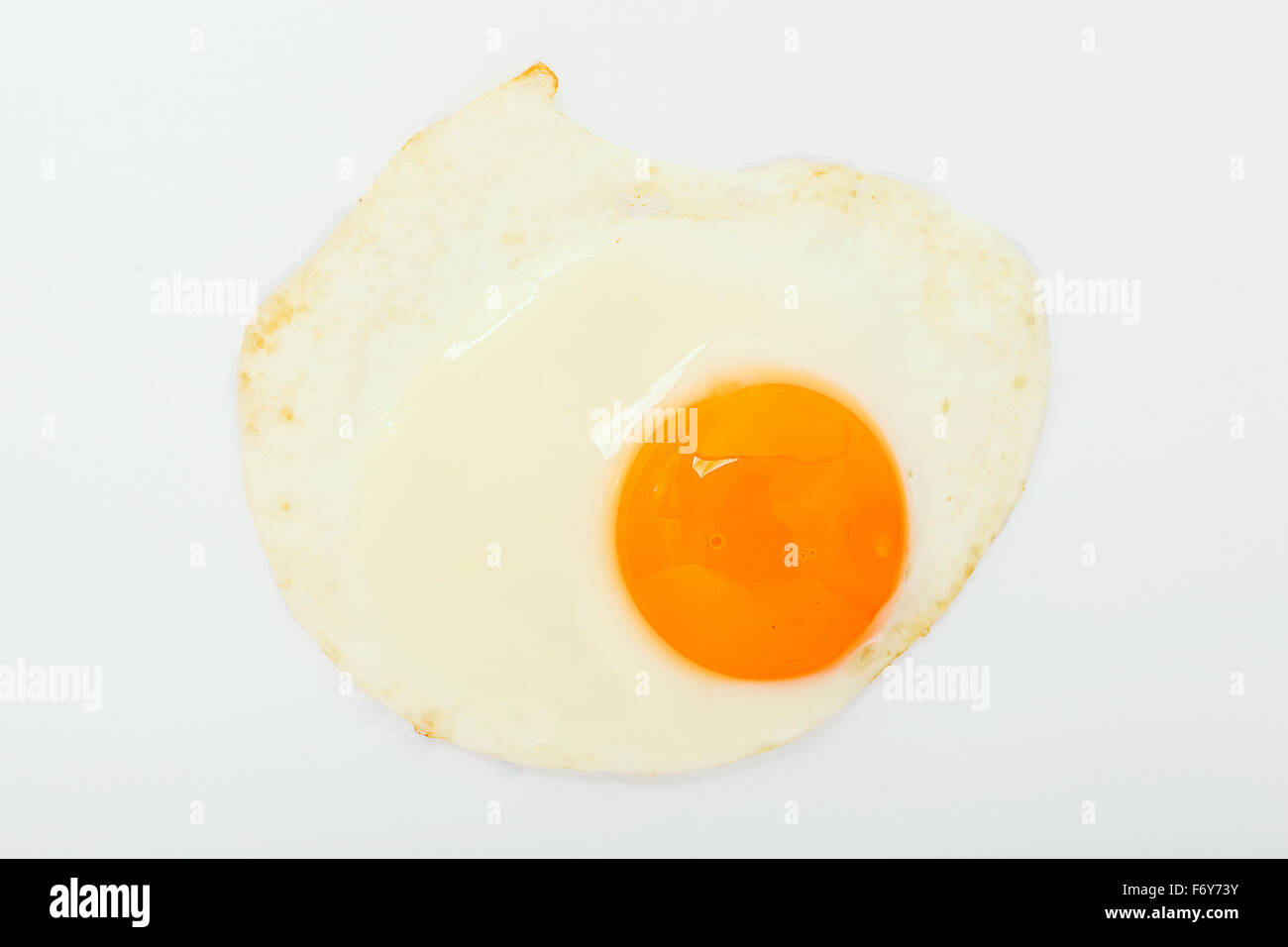 fried egg on white background Stock Photo - Alamy