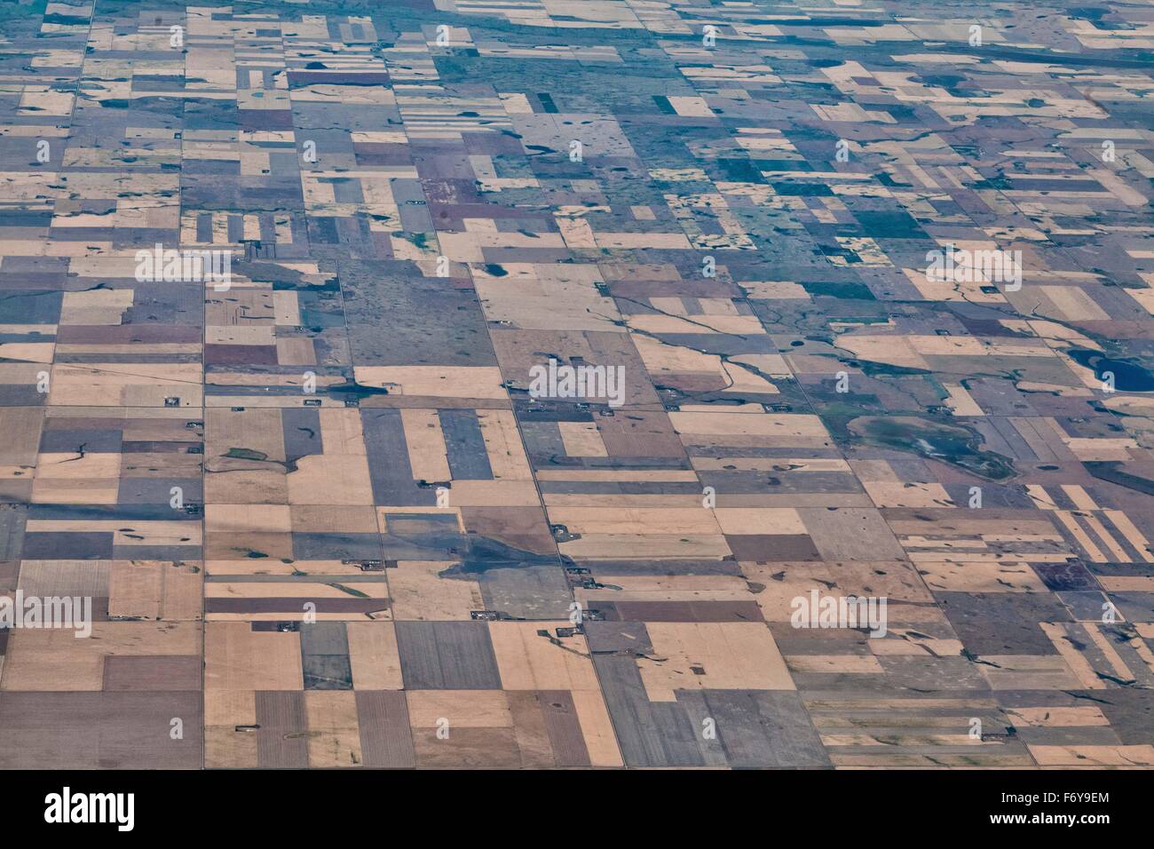 A look at the patchwork, Canadian Prairie fields of crops and pasture, view from the sky, landscape, of different colors Stock Photo
