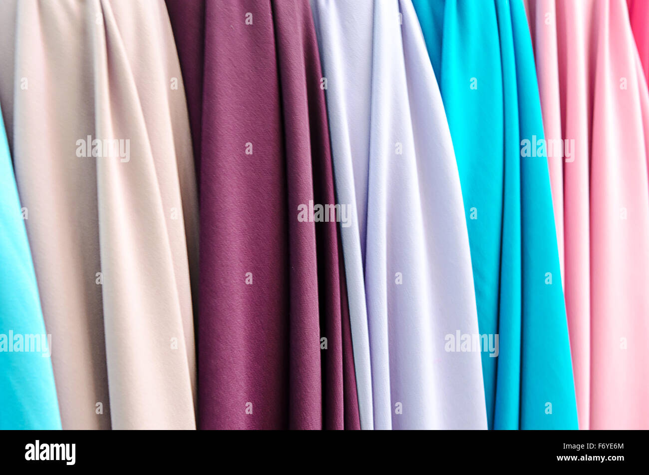 Closeup of various fabric bolts in store Stock Photo Alamy