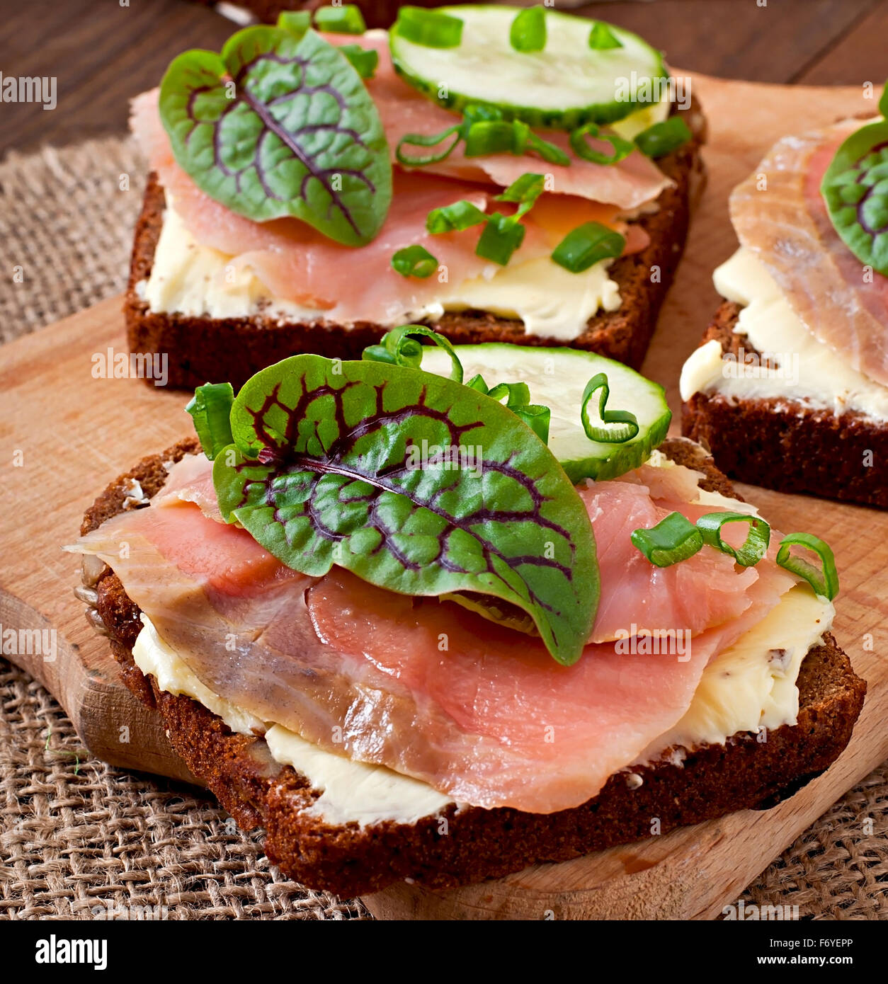 Small snacks sandwiches with salty salmon Stock Photo