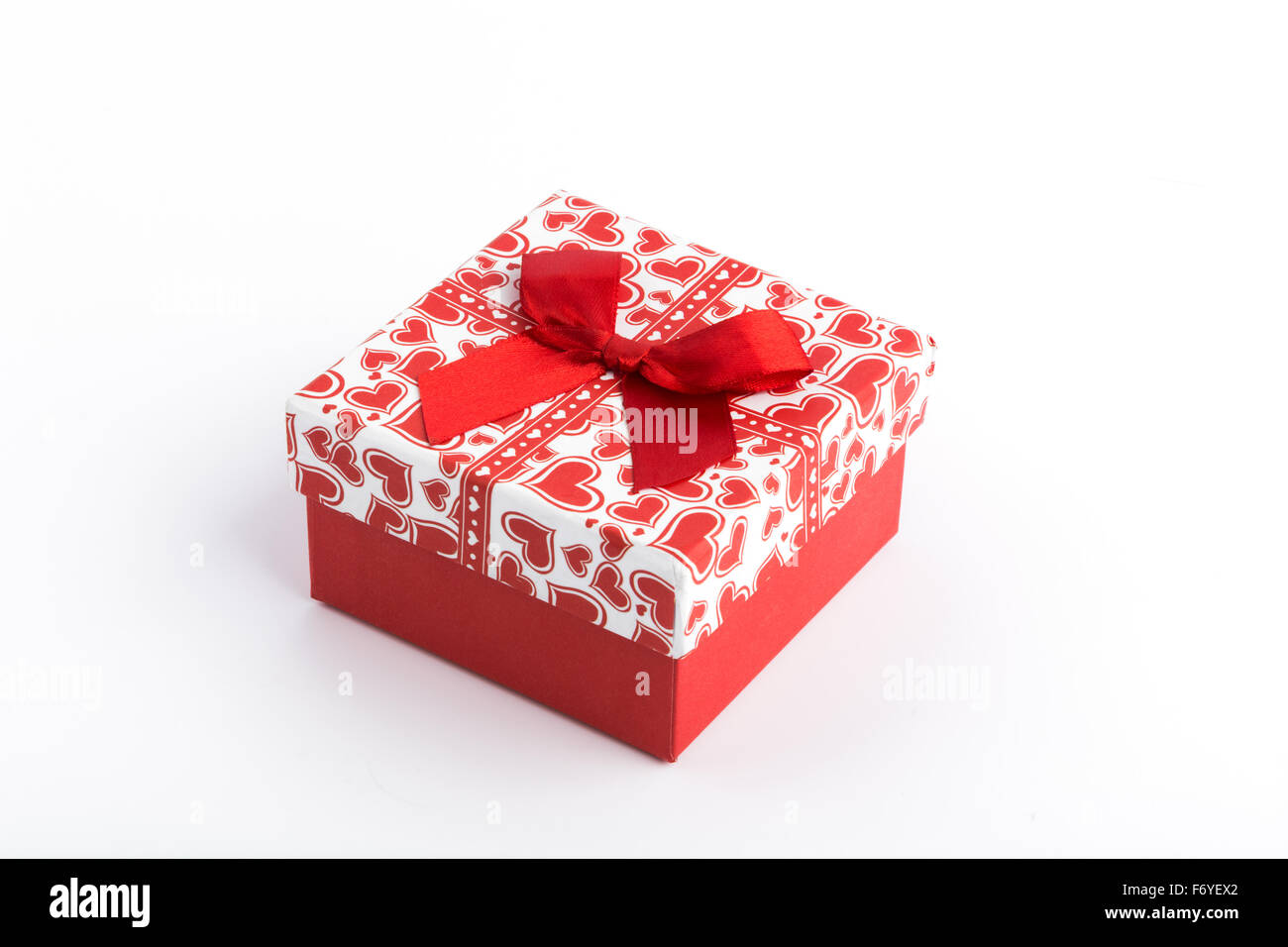 Red gift box on white background Stock Photo - Alamy
