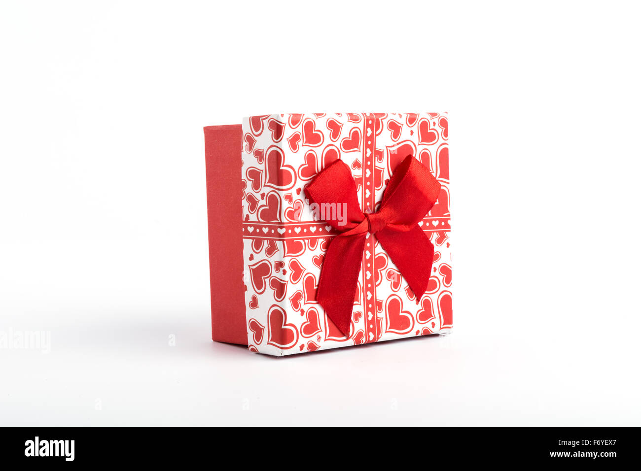 Red gift box on white background Stock Photo - Alamy
