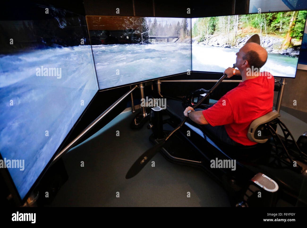 Richmond, Canada. 21st Nov, 2015. A visitor tries out a kayak simulator