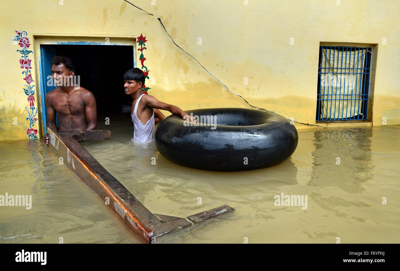 The rural village people are safe their furniturein the flood area at Varanasi, India in the year 2013. Stock Photo