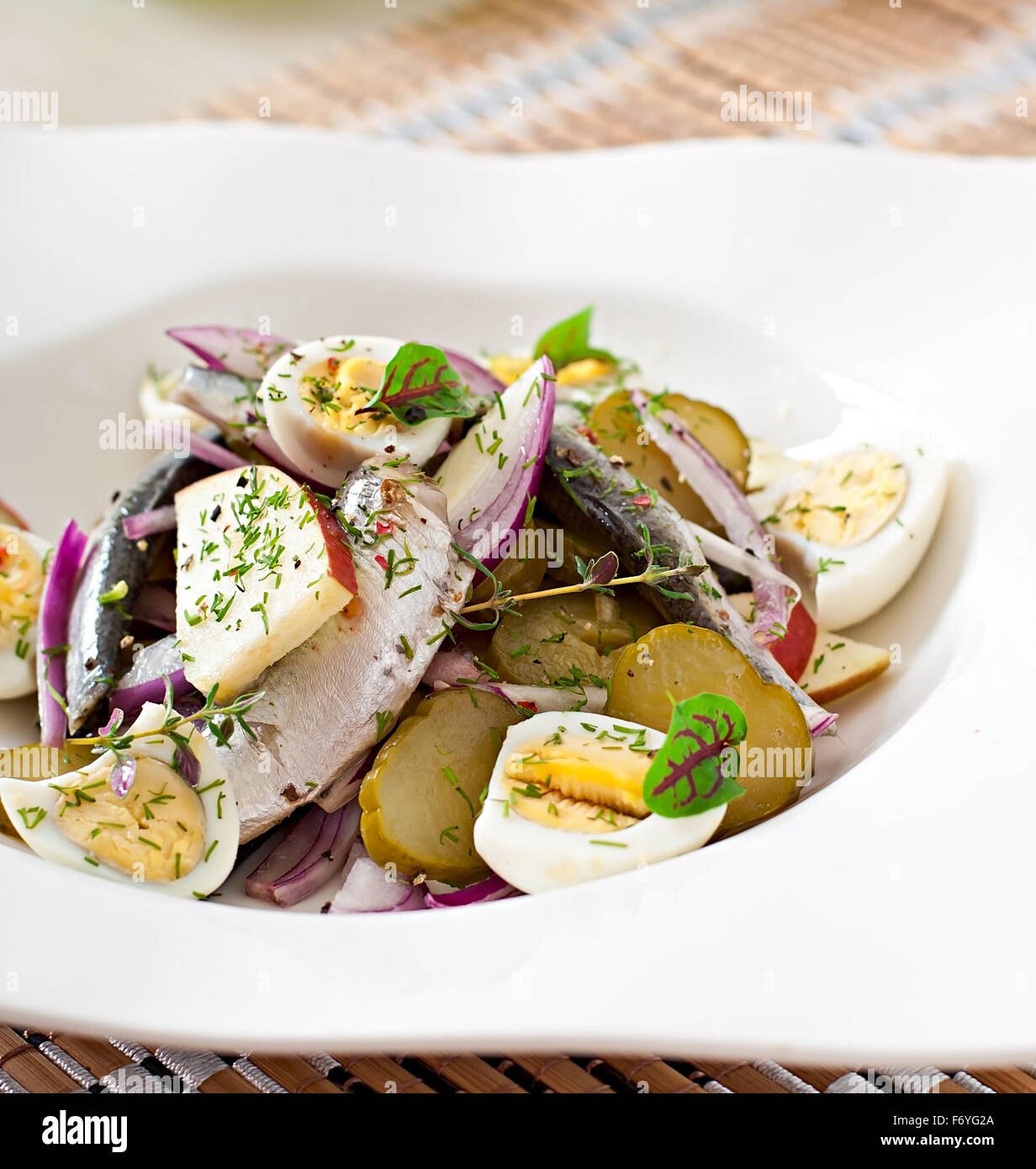 Herring salad, apples and eggs Stock Photo Alamy