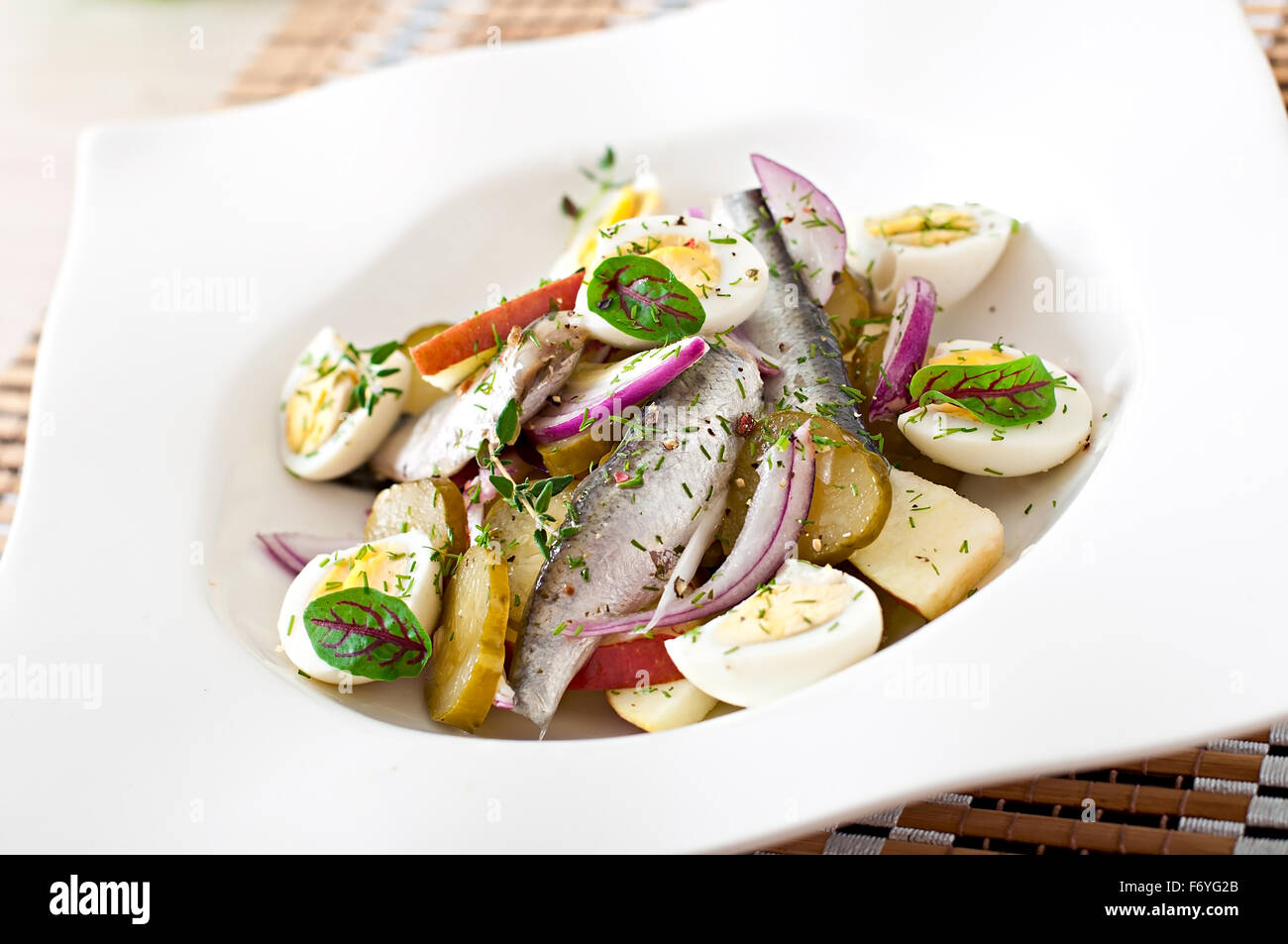 Herring salad, apples and eggs Stock Photo Alamy