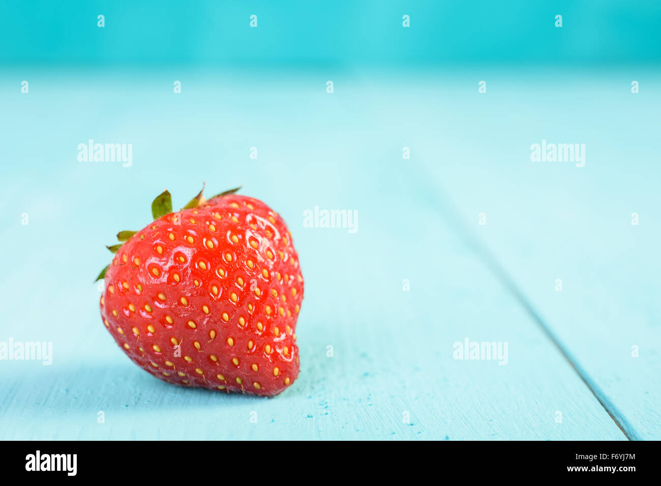 Fresh Red Strawberry On Blue Wood Boards Background Stock Photo - Alamy