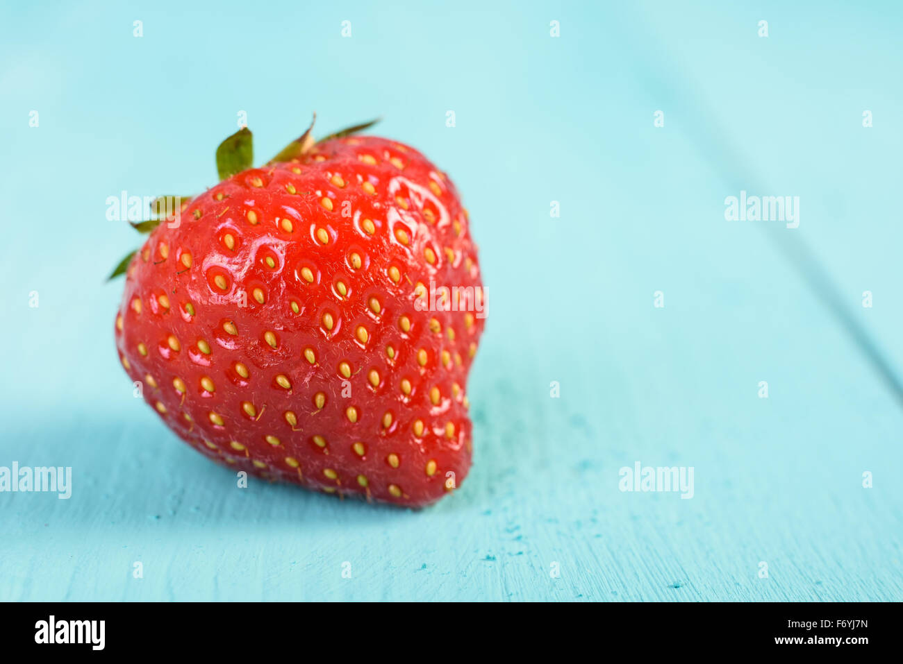 Fresh Red Strawberry On Blue Wood Boards Background Stock Photo - Alamy