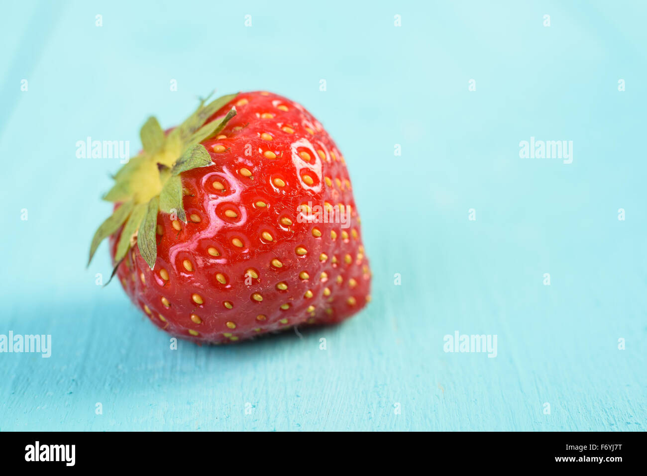Fresh Red Strawberry On Blue Wood Boards Background Stock Photo - Alamy