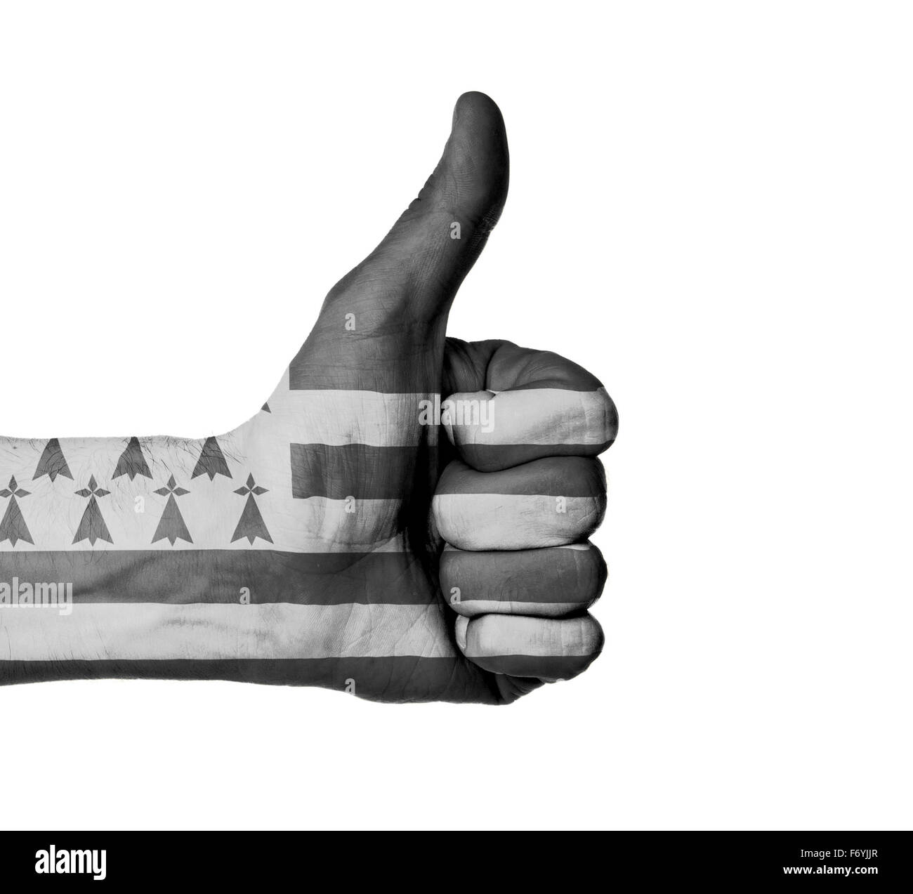 Closeup of male hand showing thumbs up sign, flag of Brittany Stock Photo