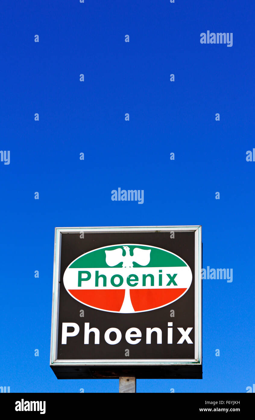 A disused Phoenix filling station brand logo outside a roadside garage at Hellesdon, Norfolk, England, United Kingdom. Stock Photo