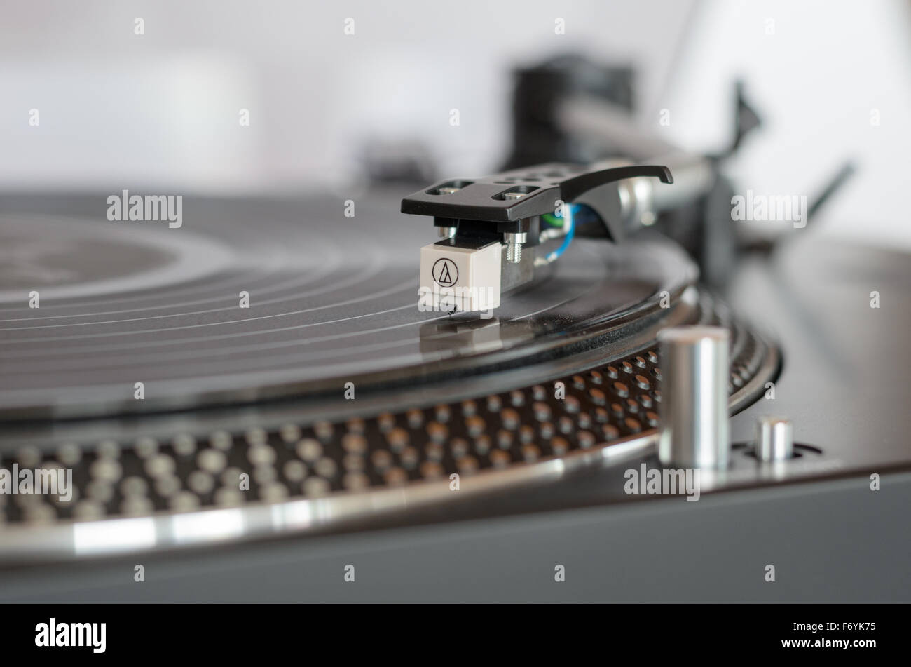 Closeup of a retro turntable while playing a vinyl record Stock Photo ...