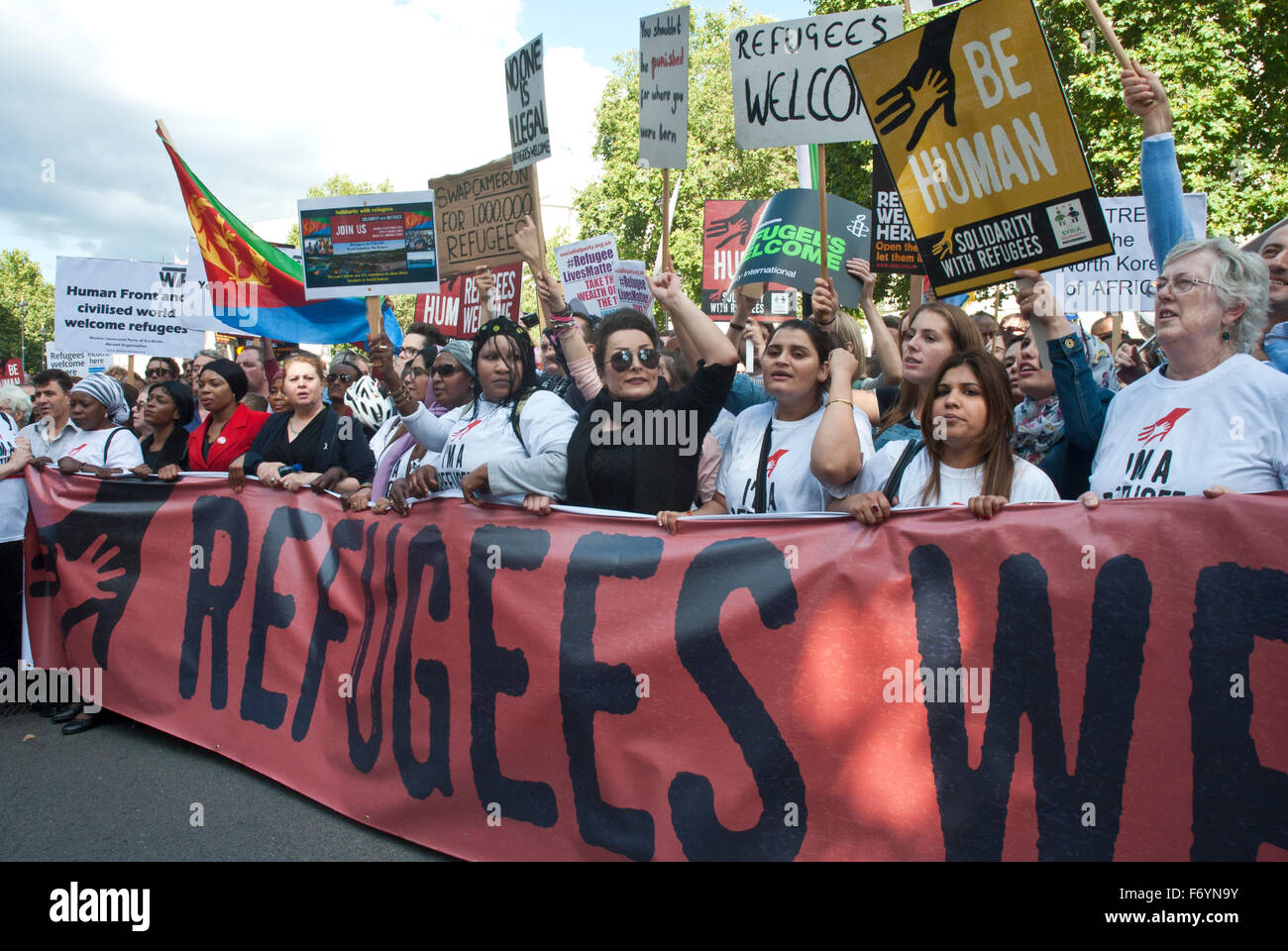 'Refugees welcome here' demonstration. Posters / banner 'Refugees are Welcome Here' Stock Photo