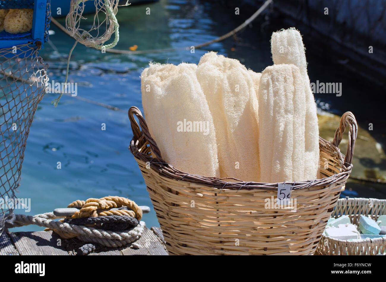 Natural luffa sponges on sale in Greece sea harbor Stock Photo