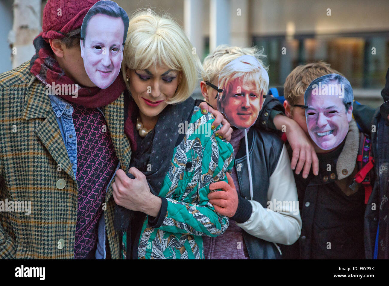 London, UK. 21st Nov, 2015. Activists from Lesbians and Gays Support the Migrants masked as David Cameron, Theresa May, Boris Johnson and Nigel Farage commiserate after a representation of the UK's 'border wall' is smashed outside the Home Office during a protest against the Immigration Bill Credit:  Mark Kerrison/Alamy Live News Stock Photo
