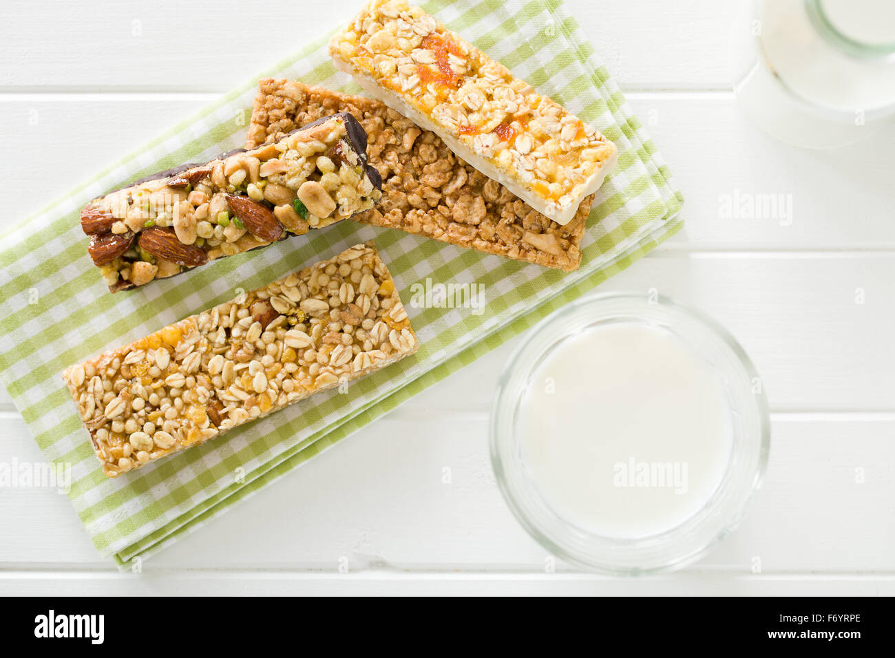 muesli bar and milk on kitchen table Stock Photo