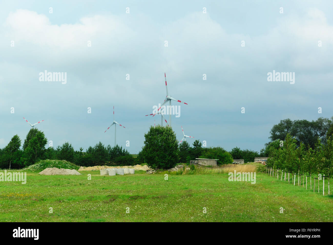 the wind-driven generator in the middle of a field serves for development of the cheap and ecology electric power Stock Photo