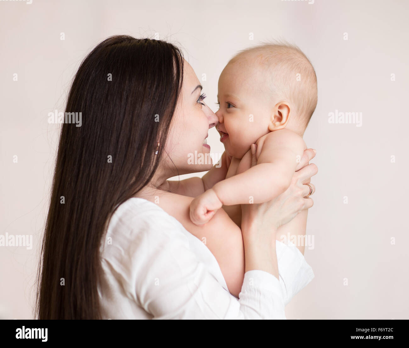 Mother holding baby son with love Stock Photo