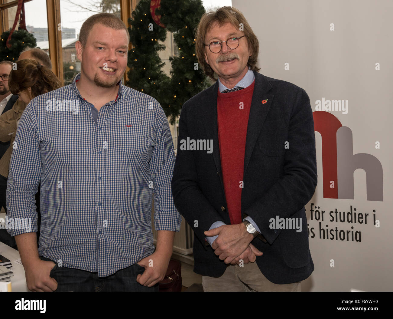 Malmo, Sweden. 21st Nov, 2015. Pål Brunnström and professor Roger Johansson from Institutet för studier i Malmös historia (The Institute for Studies of the History of Malmö). Malmo celebrates the 'Day of Book' where authors and publishers showcased their books. Credit:  Tommy Lindholm/Pacific Press/Alamy Live News Stock Photo