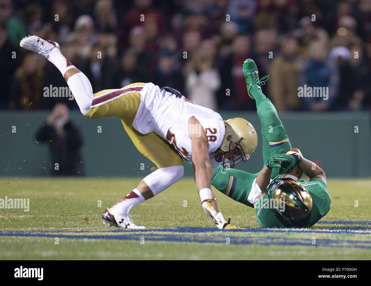 Boston, Massachusetts, USA. 21st Nov, 2015. Boston College linebacker Matt Milano (28) puts the hit on Notre Dame wide receiver Amir Carlisle (3) during NCAA football game action between the Boston College Eagles and the Notre Dame Fighting Irish at Fenway Park in Boston, Massachusetts. Notre Dame defeated Boston College 19-16. John Mersits/CSM/Alamy Live News Credit:  Cal Sport Media/Alamy Live News Stock Photo