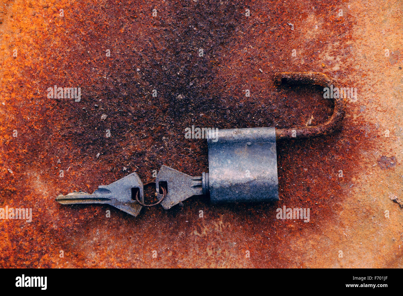 Old padlock and keys on rusty background, top view Stock Photo - Alamy