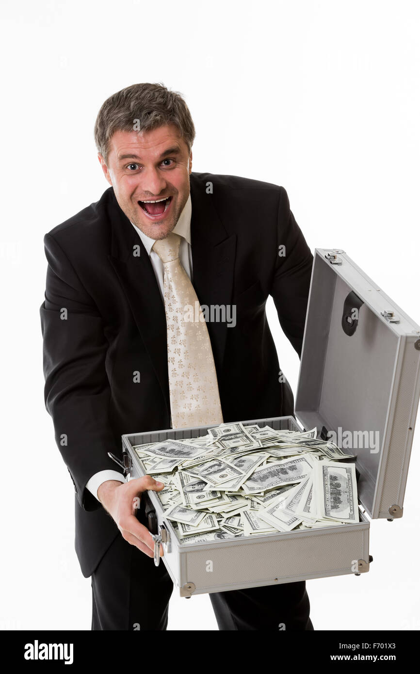 Man with suitcase full of money Stock Photo - Alamy