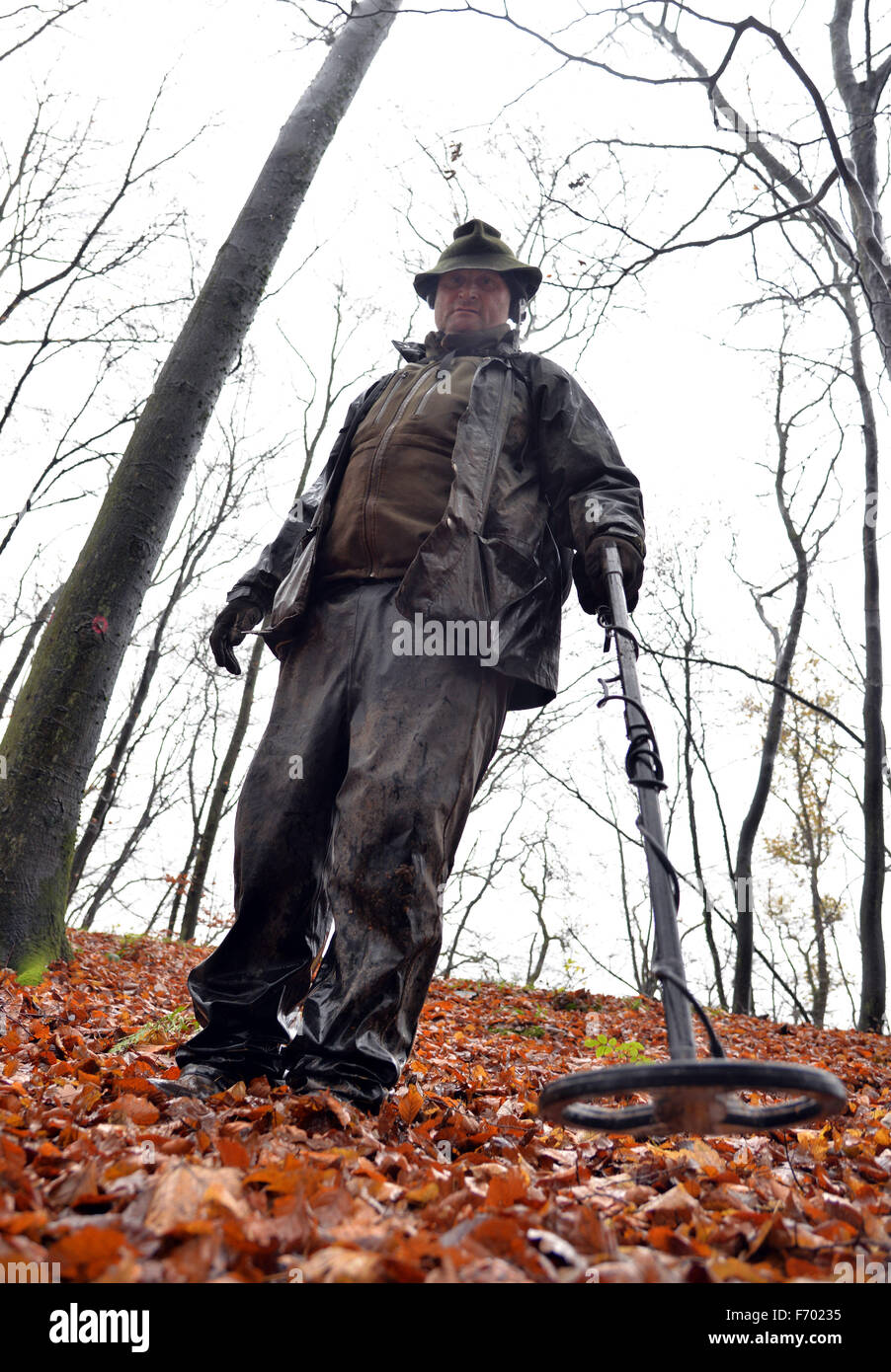 Riol, Germany. 17th Nov, 2015. Karl-Ludwig Hohentann from Hofheim walks around a wooded hill with a metal detector near Riol, Germany, 17 November 2015. Hohentann is searching the forest floor for remains of a battle between the Celtic-Germanic tribe the Treveri and the Roman Emperor Vespasian in the year 70. Photo: Harald Tittel/dpa/Alamy Live News Stock Photo
