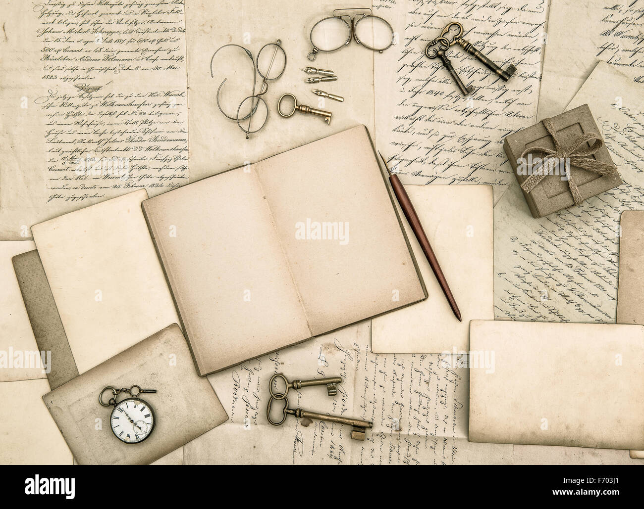 Vintage handwriting and antique office tools. Nostalgic paper background Stock Photo