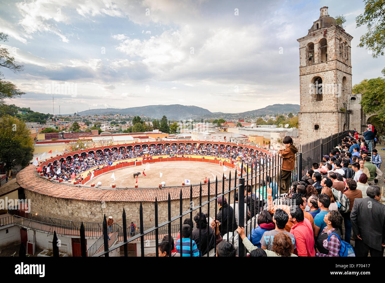 Crowd strains to see bullfight in Tlaxcala, Mexico. Stock Photo