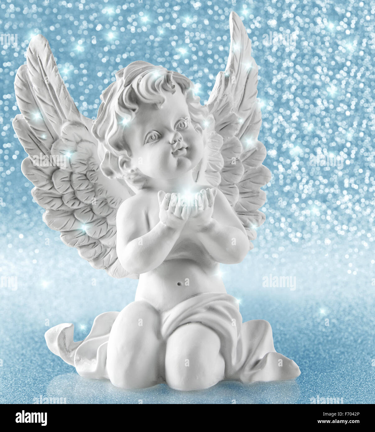 Guardian angel on shiny background. Christmas decoration. Collage with