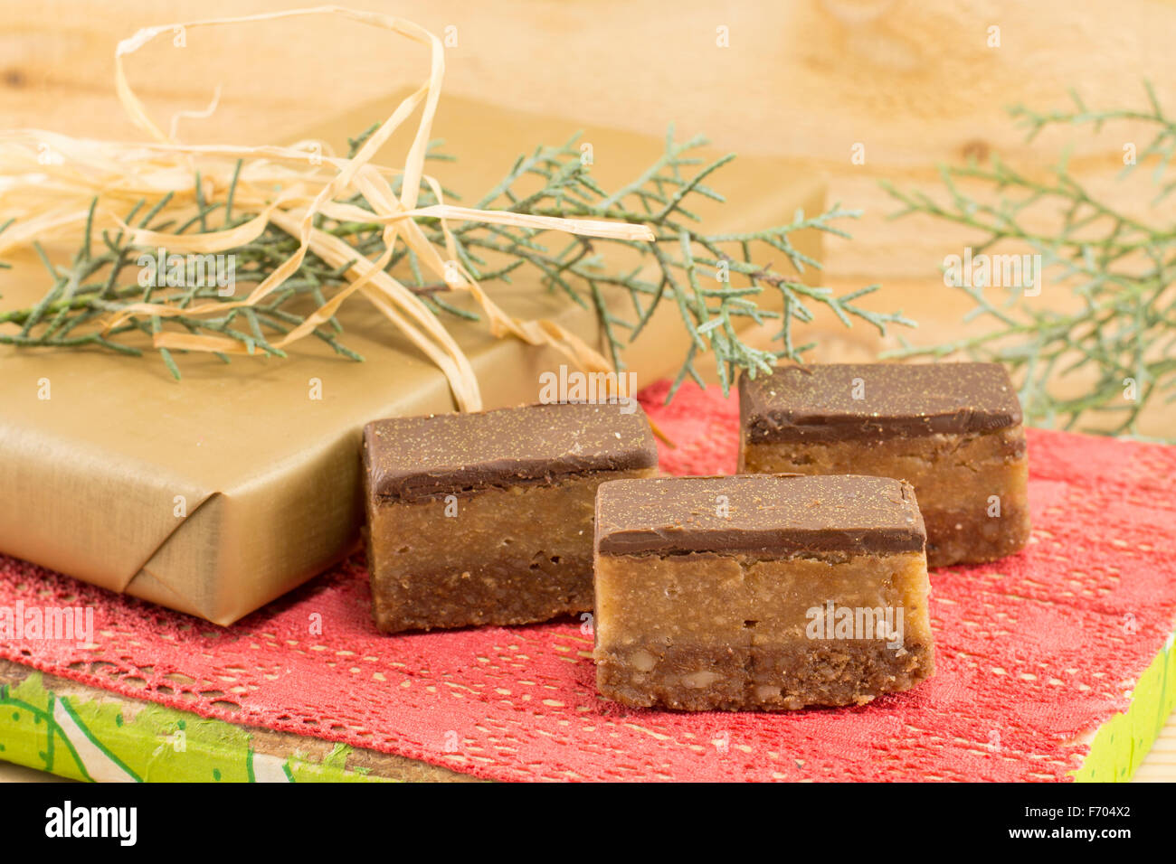 Sweet candies treat and wrapped chocolate on a wooden background Stock Photo
