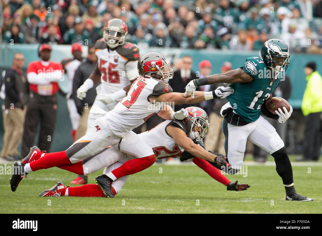 Philadelphia, Pennsylvania, USA. 22nd Nov, 2015. Philadelphia Eagles wide receiver Josh Huff (13) runs with the ball after the catch as he slips past Tampa Bay Buccaneers strong safety Chris Conte (23) and cornerback Sterling Moore (26) during the NFL game between the Tampa Bay Buccaneers and the Philadelphia Eagles at Lincoln Financial Field in Philadelphia, Pennsylvania. Christopher Szagola/CSM/Alamy Live News Stock Photo