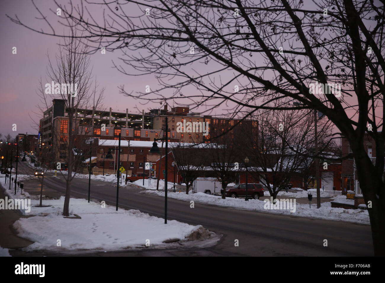 the sun glows on apartment buildings in downtown bloomington, indiana