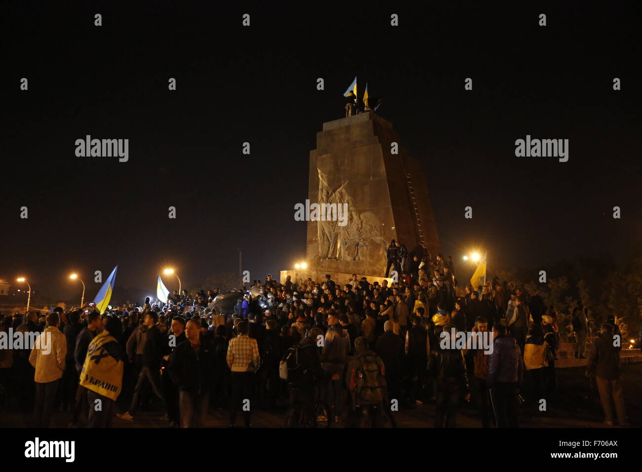 Ukrainianian protesters celebrate after cutting down the Lenin Statue on Freedom Square in Kharkiv, Ukraine, in a predominately Russian speaking area of the country. The statue, one of the largest in Ukraine, is on the largest square in the country. Stock Photo