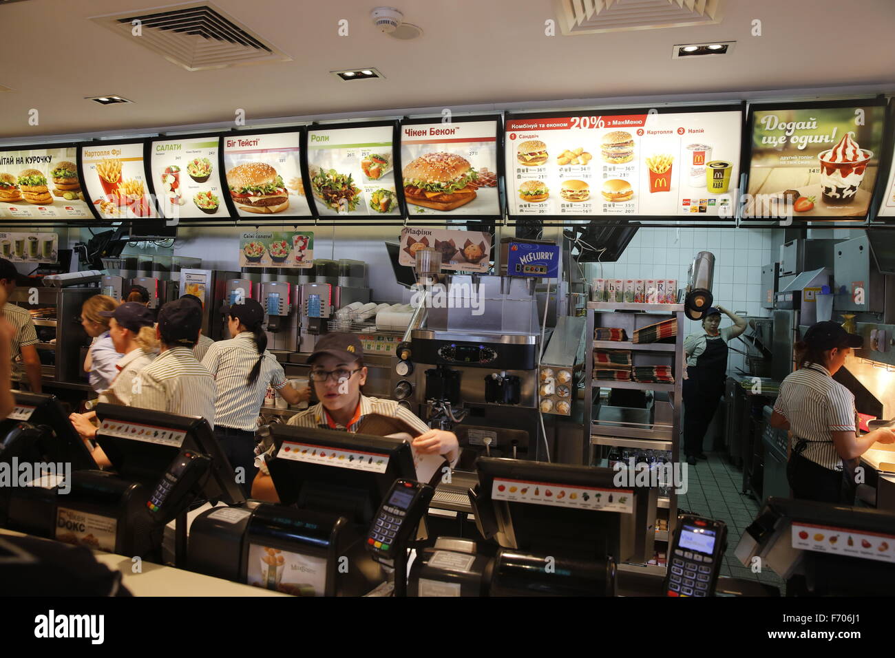 Workers manning cash registers at the McDonald's near the train Stock