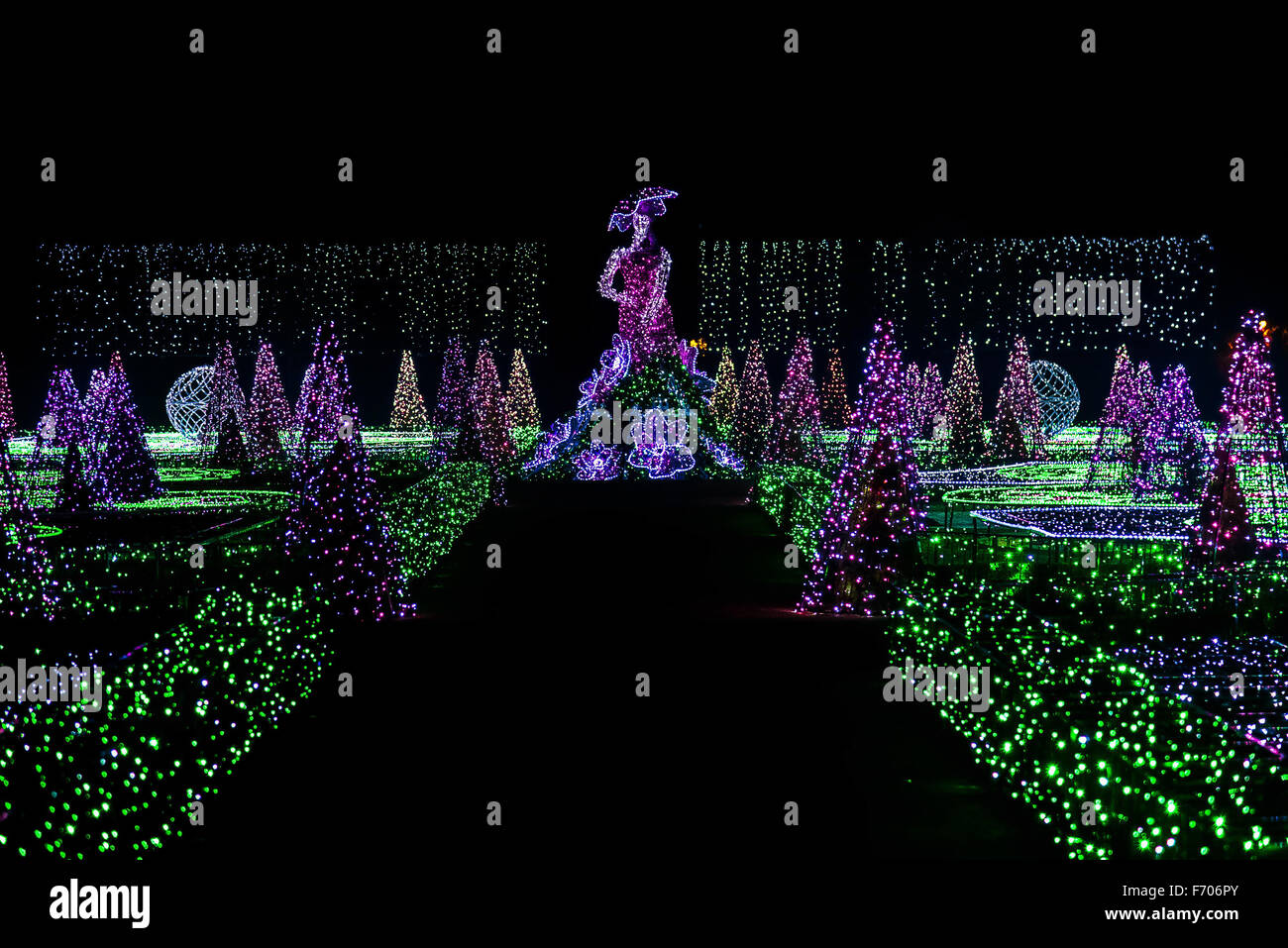 Light Show of Woman and Christmas Tree Sculptures in Royal Garden Stock Photo
