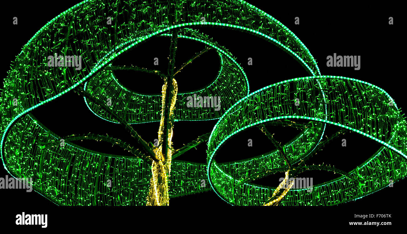 Construction as Tree from Colorful Christmas Lamps at Night Stock Photo