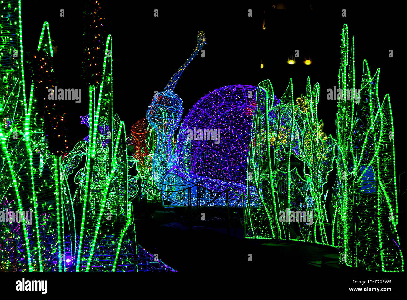 Construction of Snail and Grass made by Christmas Colorful Garland at Night Stock Photo