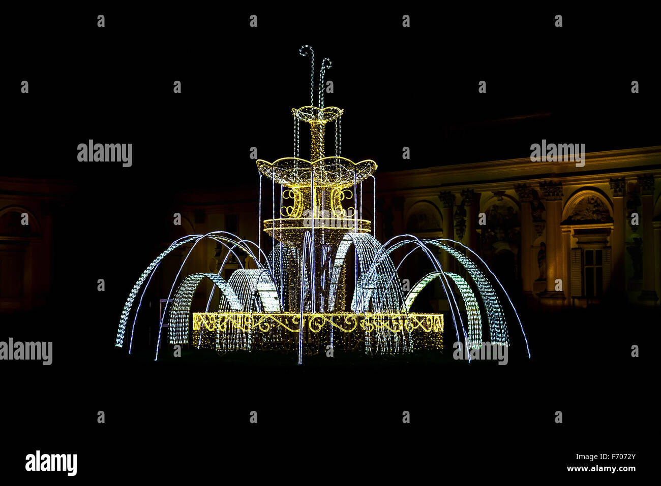 Fountain made from Christmas Lamps near Building at Night Stock Photo