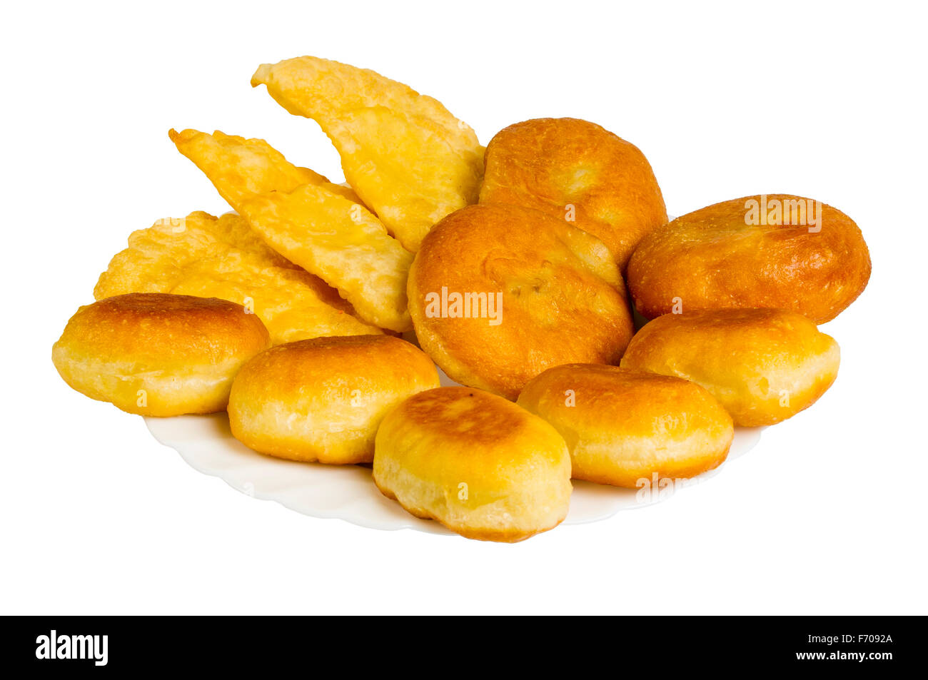 fried pies and pasties on the plate, isolated on white background Stock Photo
