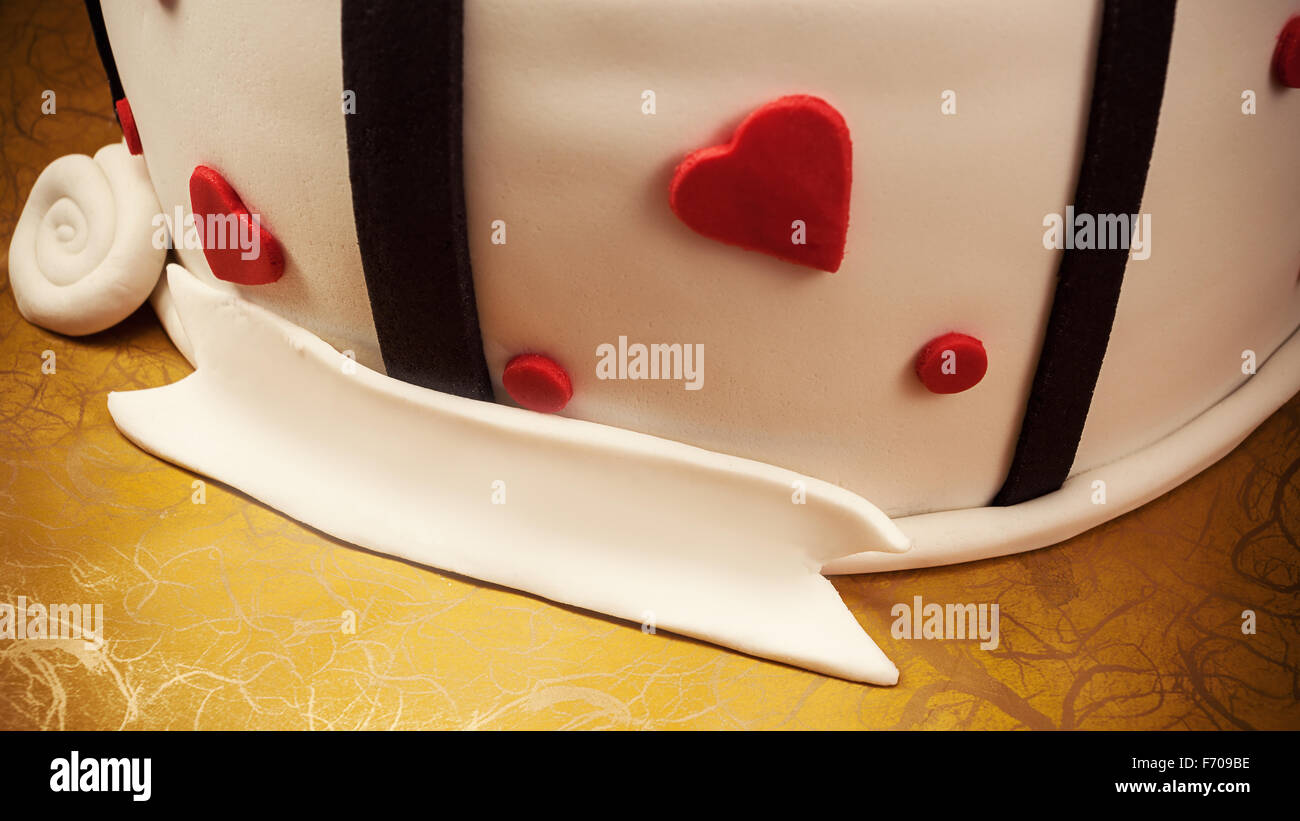 Anniversary Cake Decoration With Red Hearts And Black Ribbons