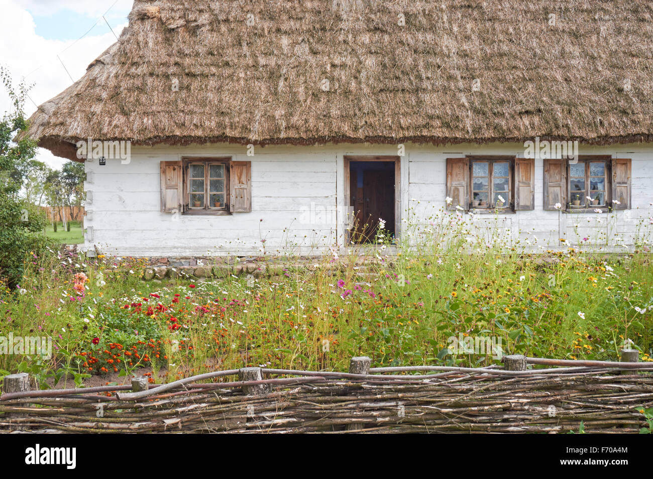 The Museum of the Mazovian Countryside in Sierpc, Poland. 19th century wooden thatched farmhouse. Stock Photo