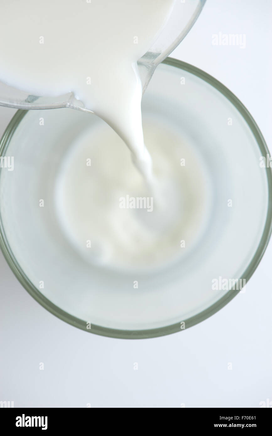 Milk being poured into glass hires stock photography and images Alamy