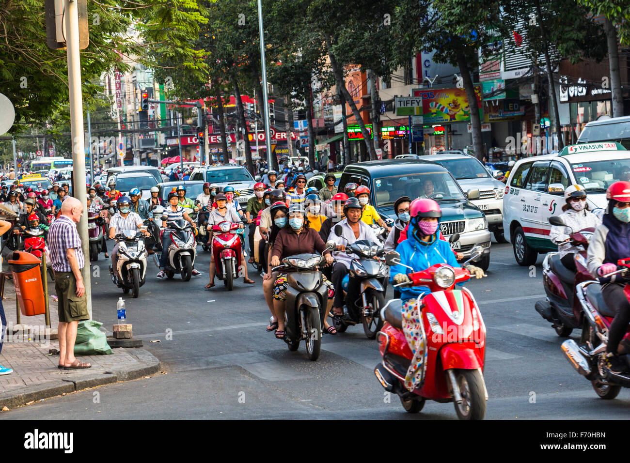 HOCHIMINH CITY, VIETNAM - Feb 24, 2017: People Cross The Road In