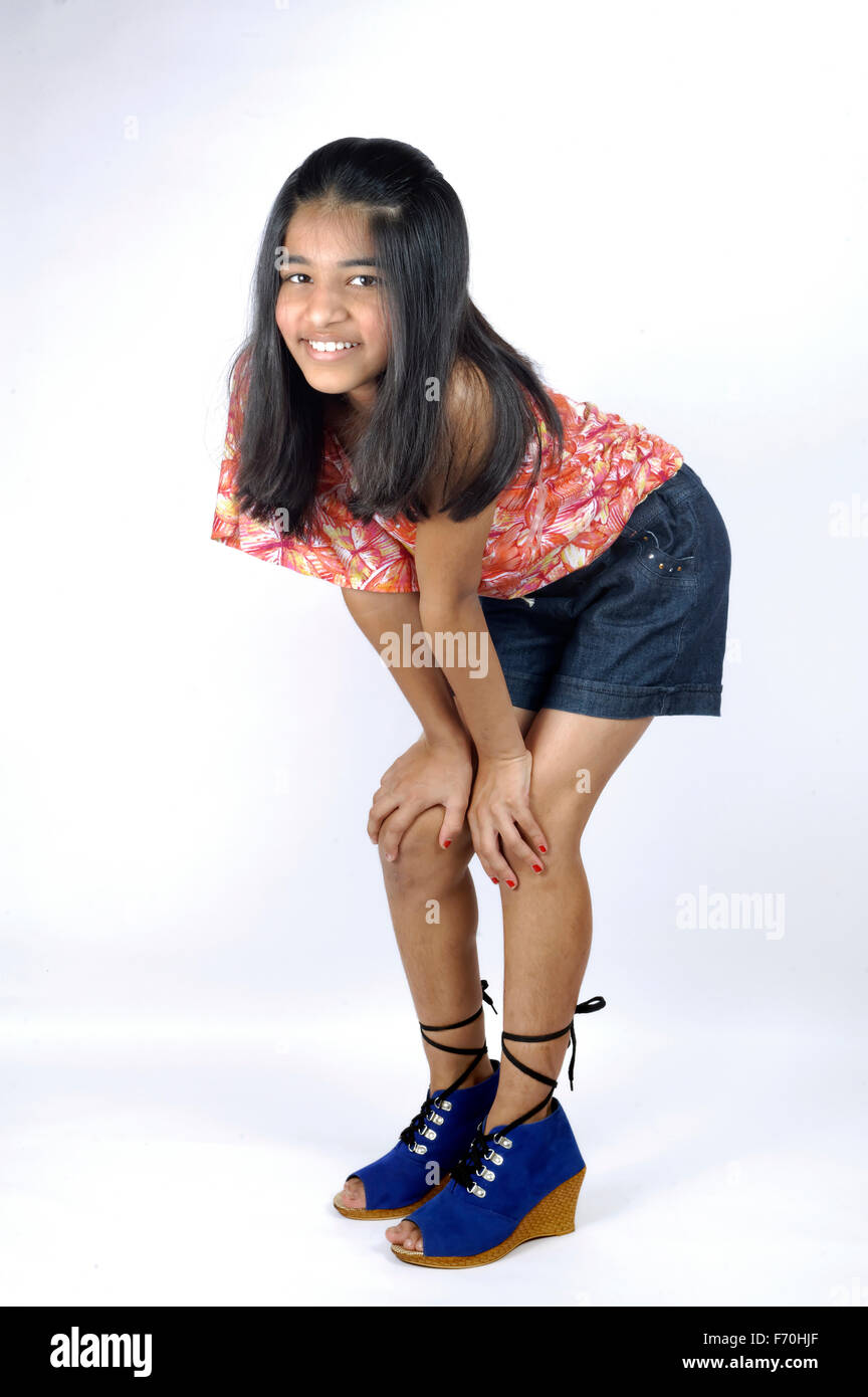 Young girl in dress bending hi-res stock photography and images - Alamy