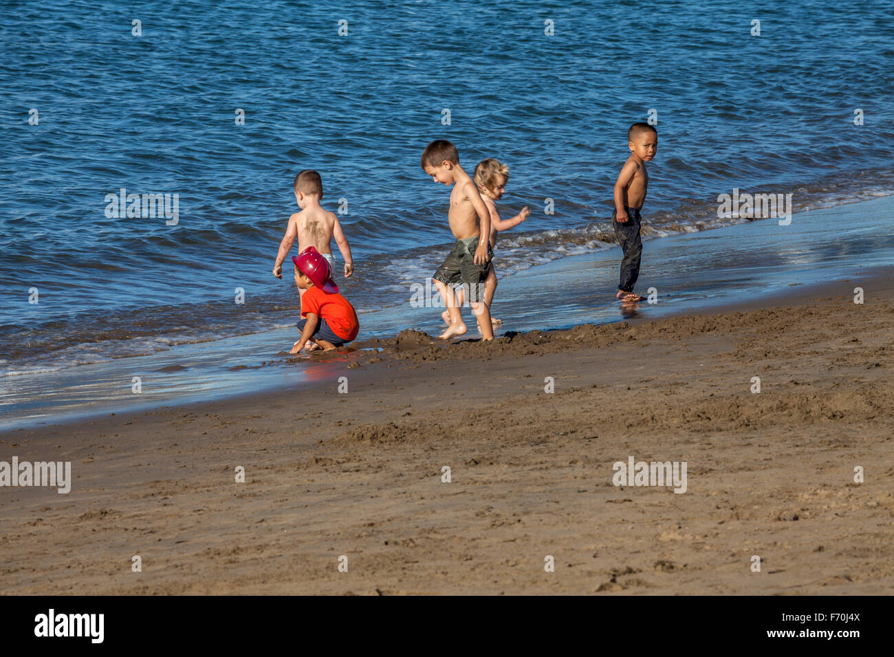 Children playing at a beach in San Francisco, California, USA Stock Photo