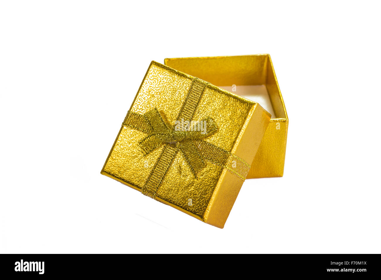 Golden gift box with golden ribbon on white background Stock Photo - Alamy